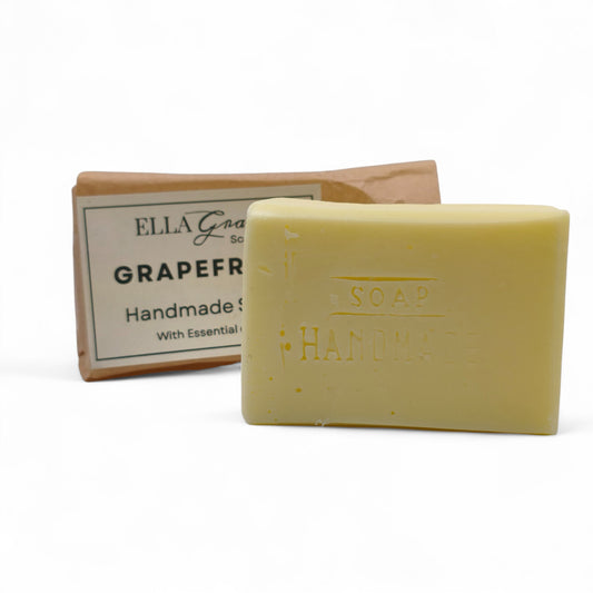 Bar of soap with a box labeled 'Ella Grace Soap' on a white background